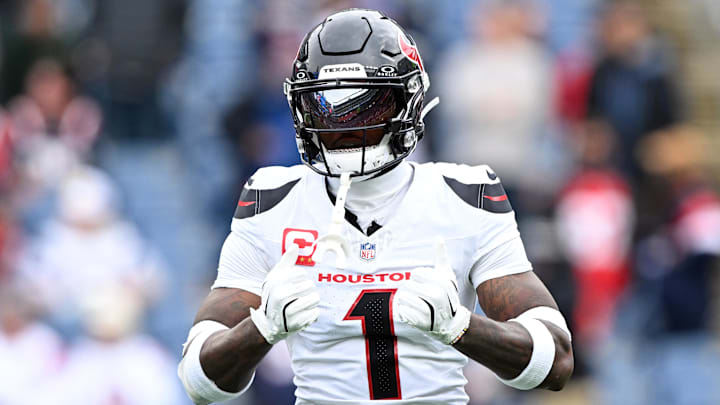 Oct 13, 2024; Foxborough, Massachusetts, USA; Houston Texans wide receiver Stefon Diggs (1) reacts before a game against the New England Patriots at Gillette Stadium. Mandatory Credit: Brian Fluharty-Imagn Images