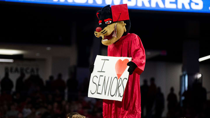 Cincinnati Bearcats mascot, the Bearcat, honors senior cheerleaders and dancers during a timeout in the first half of an NCAA men   s college basketball game on Sunday, March 5, 2023, at Fifth Third Arena in Cincinnati, concluding the Bearcats    regular season.

Southern Methodist Mustangs At Cincinnati Bearcats Ncaa Basketball March 5 2023