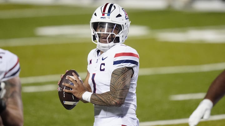 Nov 1, 2025; Boulder, Colorado, USA; Arizona Wildcats quarterback Noah Fifita (1) prepares to pass the ball in second quarter against the Colorado Buffaloes at Folsom Field. Mandatory Credit: Ron Chenoy-Imagn Images