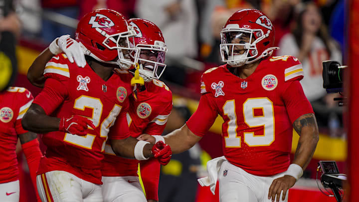 Dec 25, 2025; Kansas City, Missouri, USA; Kansas City Chiefs running back Brashard Smith (24) celebrates touchdown with Kansas City Chiefs wide receiver Juju Smith-Schuster (9) and Kansas City Chiefs quarterback Chris Oladokun (19) during the second quarter at GEHA Field at Arrowhead Stadium. Mandatory Credit: Jay Biggerstaff-Imagn Images