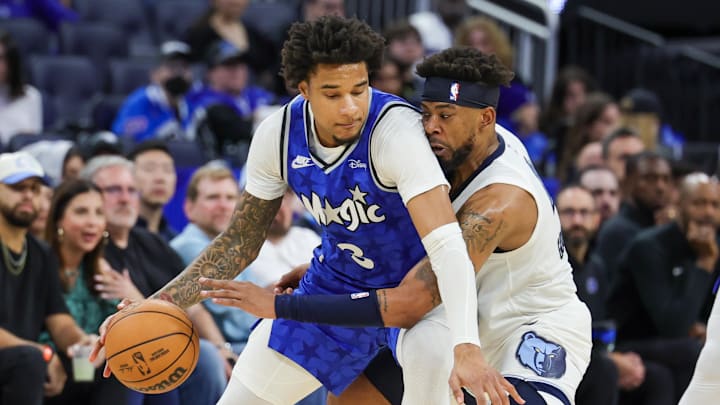Mar 30, 2024; Orlando, Florida, USA; Memphis Grizzlies guard Jordan Goodwin (4) defends Orlando Magic forward Chuma Okeke (3) during the second half at KIA Center. Mandatory Credit: Mike Watters-Imagn Images