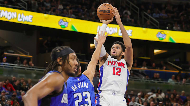 Jan 25, 2025; Orlando, Florida, USA; Detroit Pistons forward Tobias Harris (12) shoots against Orlando Magic forward Tristan da Silva (23) during the second quarter at Kia Center. Mandatory Credit: Mike Watters-Imagn Images