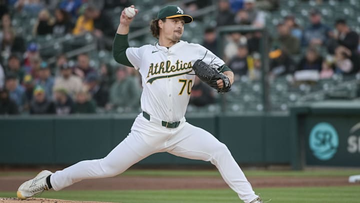 Apr 24, 2025; West Sacramento, California, USA; Athletics pitcher J.T. Ginn (70) throws a pitch against the Texas Rangers during the first inning at Sutter Health Park. Mandatory Credit: Ed Szczepanski-Imagn Images