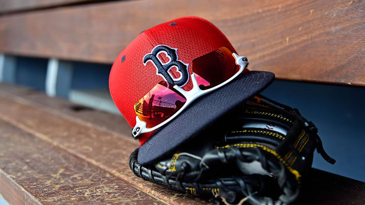 Mar 5, 2019; West Palm Beach, FL, USA; A detailed view of a Boston Red Sox cap, sunglasses and glove in the dugout  during a spring training game between the Washington Nationals and the Boston Red Sox at FITTEAM Ballpark of the Palm Beaches. Mandatory Credit: Jasen Vinlove-Imagn Images