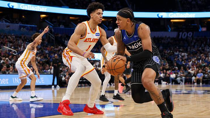 Apr 1, 2026; Orlando, Florida, USA; Orlando Magic forward Paolo Banchero (5) is guarded by Atlanta Hawks forward Jalen Johnson (1) in the third quarter at Kia Center. Mandatory Credit: Nathan Ray Seebeck-Imagn Images