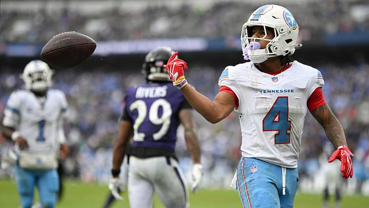 Oct 4, 2026; Baltimore, Maryland, USA;  Tennessee Titans wide receiver Wan'Dale Robinson (4) tosses the ball after a play against the Baltimore Ravens during the fourth quarter at M&T Bank Stadium.  Mandatory Credit: Tommy Gilligan-Imagn Images