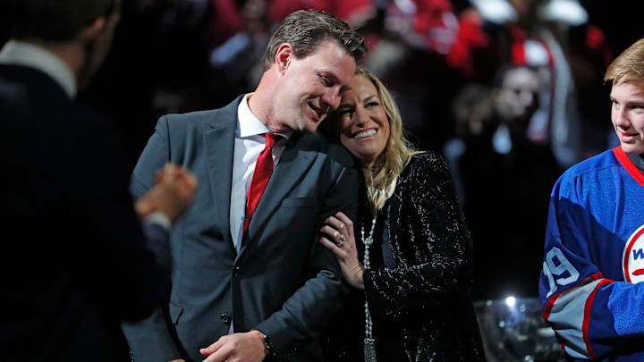 Andrea Doan hugs her husband Shane Doan as he receives a standing ovation during his jersey retirement ceremony at Gila River Arena in Glendale, Ariz. on February 24, 2019.