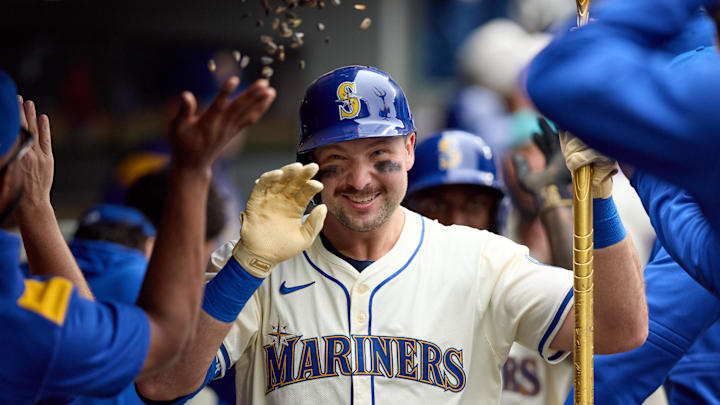 Sep 14, 2025; Seattle, Washington, USA; Seattle Mariners catcher Cal Raleigh (29) is greeted in the dugout after hitting a two-run home against the Los Angeles Angels in the first inning at T-Mobile Park. Mandatory Credit: John Froschauer-Imagn Images Sep 14, 2025; Seattle, Washington, USA; Seattle Mariners catcher Cal Raleigh (29) is greeted in the dugout after hitting a two-run home against the Los Angeles Angels in the first inning at T-Mobile Park. Mandatory Credit: John Froschauer-Imagn Images