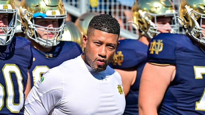 Sep 21, 2024; South Bend, Indiana, USA; Notre Dame Fighting Irish head coach Marcus Freeman prepares to lead his players onto the field for the game against the Miami Redhawks at Notre Dame Stadium. 