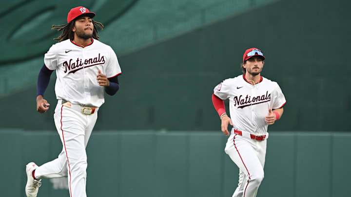 Aug 26, 2024; Washington, District of Columbia, USA; Washington Nationals left fielder James Wood (29) and center fielder Dylan Crews (3) warm up before a game against the New York Yankees at Nationals Park. Mandatory Credit: Rafael Suanes-Imagn Images