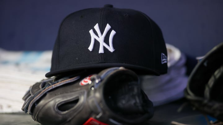 Aug 14, 2023; Atlanta, Georgia, USA; A detailed view of a New York Yankees hat and glove on the