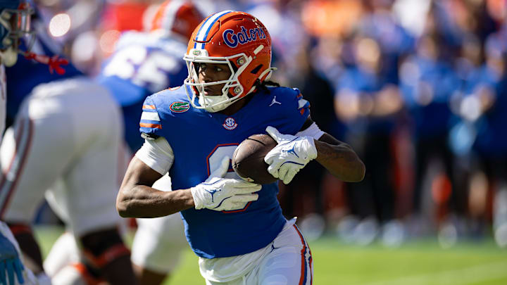 Nov 23, 2024; Gainesville, Florida, USA; Florida Gators wide receiver Elijhah Badger (6) rushes with the ball against the Mississippi Rebels during the first half at Ben Hill Griffin Stadium. Mandatory Credit: Matt Pendleton-Imagn Images