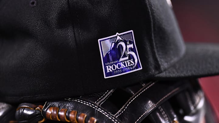 Sep 25, 2018; Denver, CO, USA; General view of Colorado Rockies center fielder Charlie Blackmon (19) (not pictured) cap and glove with the 25th anniversary logo during the game against the Philadelphia Phillies at Coors Field. 