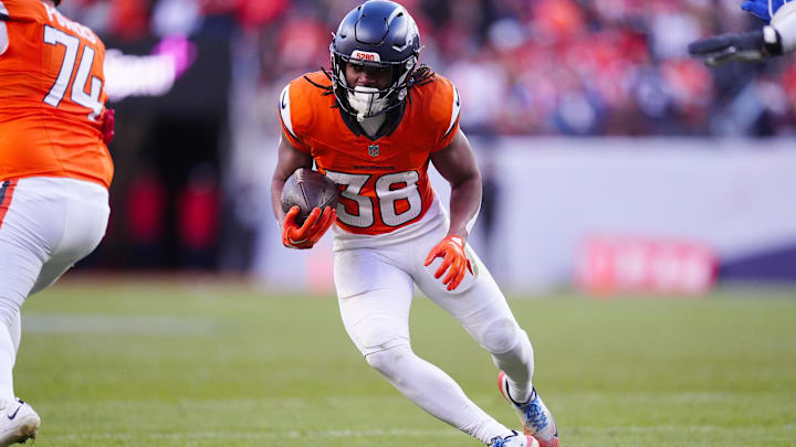 Jan 17, 2026; Denver, CO, USA; Denver Broncos running back Jaleel McLaughlin (38) runs during the third quarter of an AFC Divisional Round playoff game against the Buffalo Bills at Empower Field at Mile High. Mandatory Credit: Ron Chenoy-Imagn Images