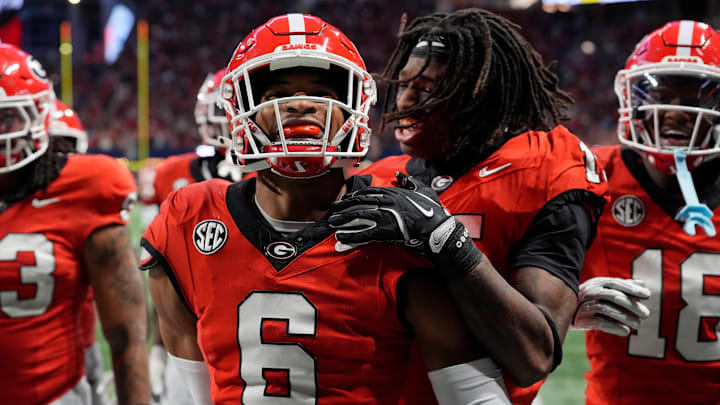 Georgia defensive back Daylen Everette (6) celebrates with his teammates after picking off a pass from Texas quarterback Quinn Ewers (3) during the second half of the SEC championship game against Texas in Atlanta, on Saturday, Dec. 7, 2024. Georgia defensive back Daylen Everette (6) celebrates with his teammates after picking off a pass from Texas quarterback Quinn Ewers (3) during the second half of the SEC championship game against Texas in Atlanta, on Saturday, Dec. 7, 2024.