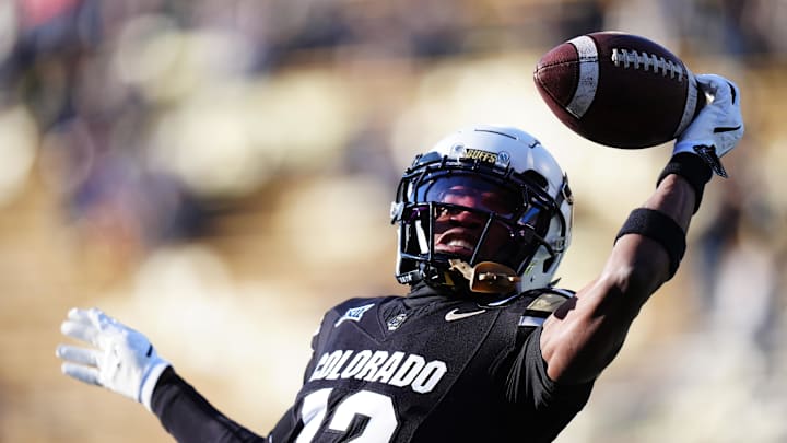 Nov 29, 2024; Boulder, Colorado, USA; Colorado Buffaloes wide receiver Travis Hunter (12) warms up before the game against the Oklahoma State Cowboys at Folsom Field. Mandatory Credit: Ron Chenoy-Imagn Images Nov 29, 2024; Boulder, Colorado, USA; Colorado Buffaloes wide receiver Travis Hunter (12) warms up before the game against the Oklahoma State Cowboys at Folsom Field. Mandatory Credit: Ron Chenoy-Imagn Images