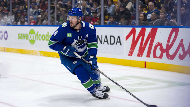 Nov 16, 2024; Vancouver, British Columbia, CAN; Vancouver Canucks forward J.T. Miller (9) handles the puck against the Chicago Blackhawks during the first period at Rogers Arena. Mandatory Credit: Bob Frid-Imagn Images