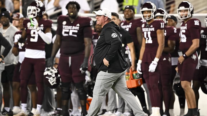 Nov 16, 2024; College Station, Texas, USA; Texas A&M Aggies head coach Mike Elko reacts during the first half against the New Mexico State Aggies at Kyle Field. Nov 16, 2024; College Station, Texas, USA; Texas A&M Aggies head coach Mike Elko reacts during the first half against the New Mexico State Aggies at Kyle Field.