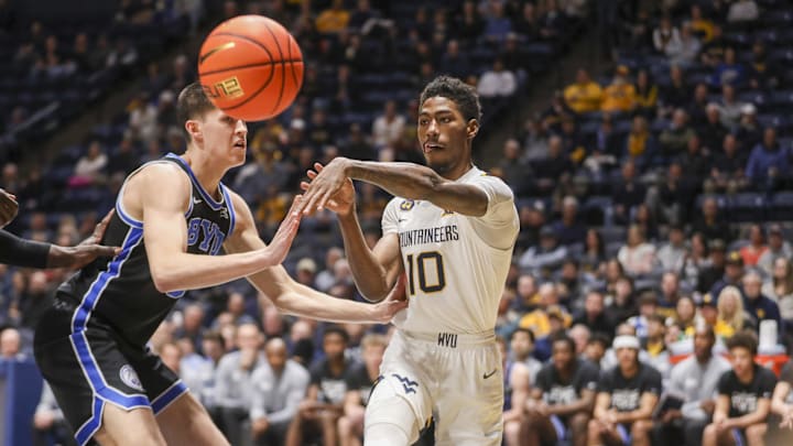 Feb 11, 2025; Morgantown, West Virginia, USA; West Virginia Mountaineers guard Sencire Harris (10) passes the ball during the first half against the Brigham Young Cougars at WVU Coliseum. Mandatory Credit: Ben Queen-Imagn Images