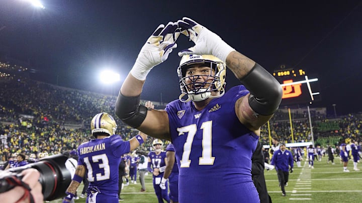 Nov 12, 2022; Eugene, Oregon, USA; Washington Huskies offensive lineman Nate Kalepo (71) celebrates