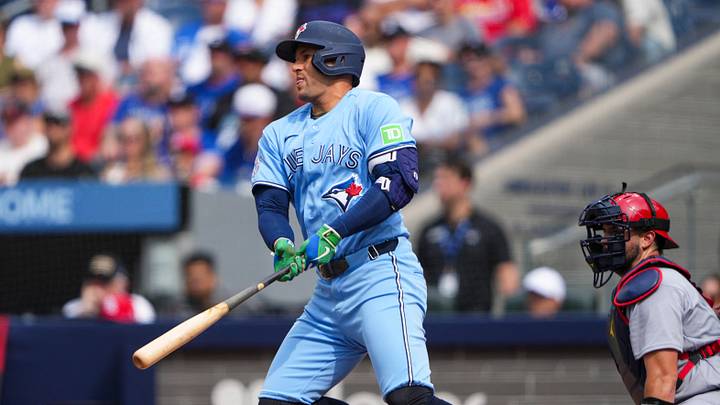 Aug 1, 2026; Toronto, Ontario, CAN;  Toronto Blue Jays designated hitter George Springer (4) hits a single against the St. Louis Cardinals during the third inning at Rogers Centre. Mandatory Credit: Kevin Sousa-Imagn Images