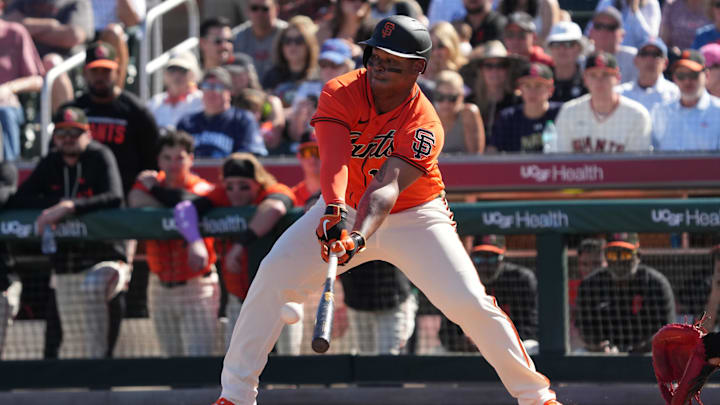 Feb 22, 2026; Scottsdale, Arizona, USA; San Francisco Giants designated hitter Rafael Devers (16) hits against the Chicago Cubs in the third inning at Scottsdale Stadium. Mandatory Credit: Rick Scuteri-Imagn Images