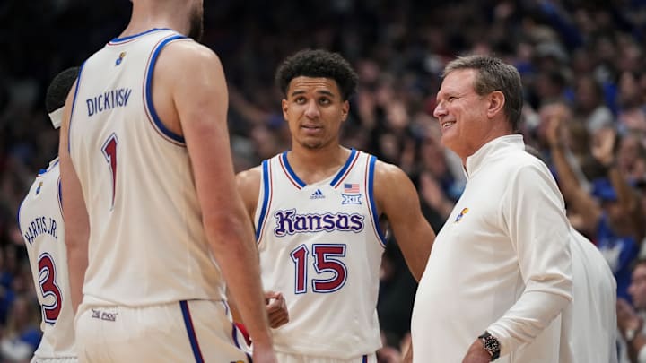 Dec 1, 2023; Lawrence, Kansas, USA; Kansas Jayhawks head coach Bill Self talks with players during a game