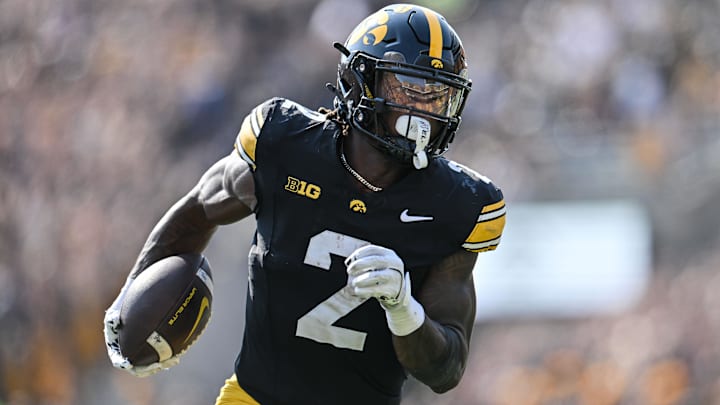 Oct 12, 2024; Iowa City, Iowa, USA; Iowa Hawkeyes running back Kaleb Johnson (2) runs for a 17 yard touchdown run during the second quarter against the Washington Huskies at Kinnick Stadium. 