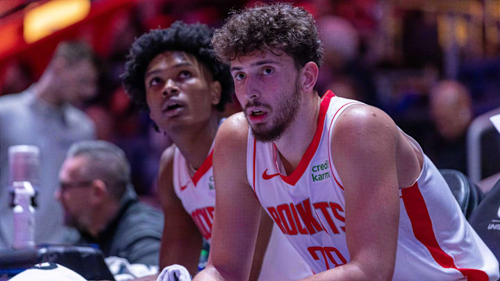 Jan 12, 2024; Detroit, Michigan, USA; Houston Rockets center Alperen Sengun (28) and forward Amen Thompson (1) sit on the sidelines on a play stoppage against the Detroit Pistons during the in the first half at Little Caesars Arena. Mandatory Credit: David Reginek-Imagn Images
