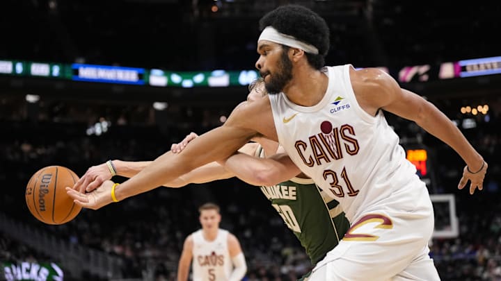 Feb 25, 2026; Milwaukee, Wisconsin, USA;  Cleveland Cavaliers center Jarrett Allen (31) and Milwaukee Bucks guard AJ Green (20) reach for the loose ball during the second quarter at Fiserv Forum. Mandatory Credit: Jeff Hanisch-Imagn Images