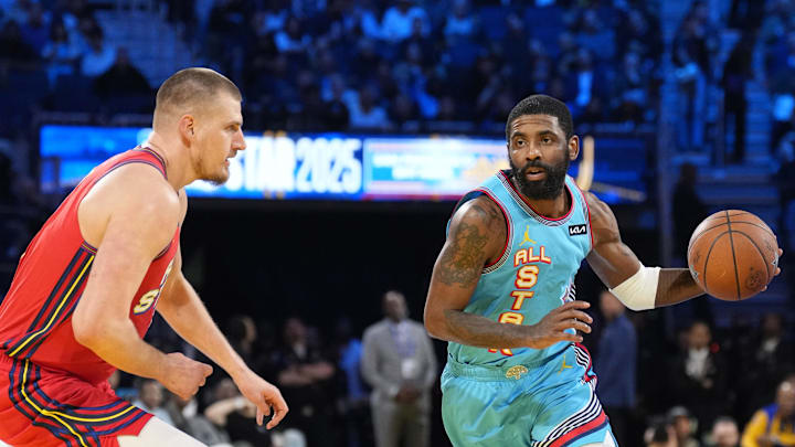 Feb 16, 2025; San Francisco, CA, USA; Shaq’s OGs guard Kyrie Irving (11) of the Dallas Mavericks controls the ball against Chuck’s Global Stars center Nikola Jokic (15) of the Denver Nuggets during the 2025 NBA All Star Game at Chase Center. Mandatory Credit: Kyle Terada-Imagn Images