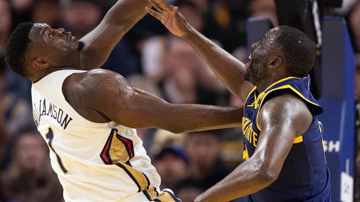 Golden State Warriors forward Draymond Green (23) blocks a shot by New Orleans Pelicans forward Zion Williamson (1) during the third quarter at Chase Center. Mandatory Credit: D. Ross Cameron-Imagn Images