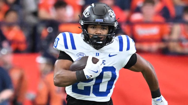 Sep 27, 2025; Syracuse, New York, USA; Duke Blue Devils running back Nate Sheppard (20) carries the ball in the second quarter against the Syracuse Orange at the JMA Wireless Dome. Mandatory Credit: Mark Konezny-Imagn Images