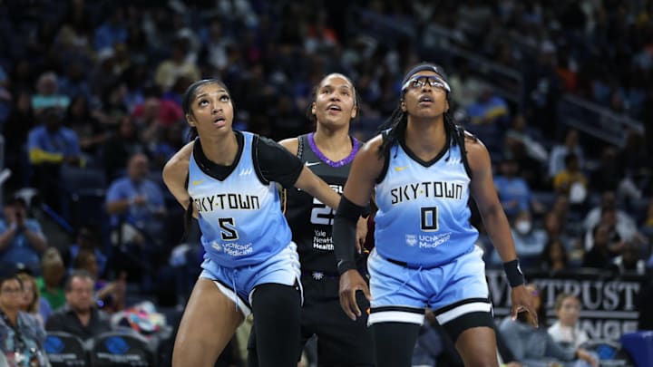 Angel Reese (5 Chicago Sky) and Diamond DeShields (0 Chicago Sky) box out Alyssa Thomas (25 Connecticut Sun) on May 25, 2024.