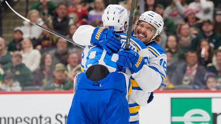 Mar 1, 2026; Saint Paul, Minnesota, USA; St. Louis Blues left wing Pavel Buchnevich (89) celebrates with center Robert Thomas (18) after scoring on the Minnesota Wild in the third period at Grand Casino Arena. Mandatory Credit: Matt Blewett-Imagn Images