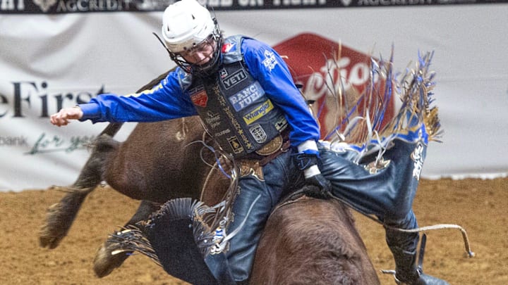 Contestant Stetson Wright of Beaver, Utah, competes in steer wrestling during the Dixie National Rodeo in Jackson, Miss., Wednesday, Feb. 12, 2025.