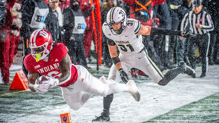 Indiana's Justice Ellison (6) dives for the endzone during the Indiana versus Purdue football game at Memorial Stadium on Saturday, Nov. 30, 2024.
