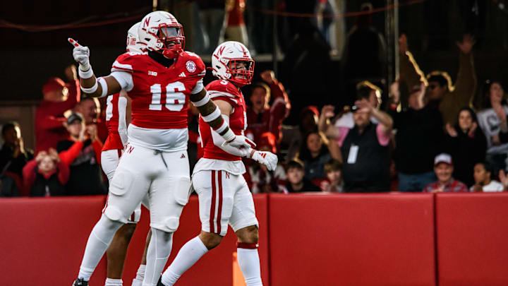 Elijah Jeudy (16) celebrates an incomplete pass from Wisconsin quarterback, Braedyn Locke. 