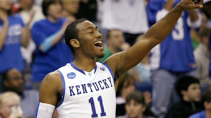 Mar 20, 2010; New Orleans, LA, USA; Kentucky Wildcats guard John Wall (11) celebrates a basket by a teammate against the Wake Forest Demon Deacons during the second half in the second round of the 2010 NCAA mens basketball tournament at the New Orleans Arena. Kentucky defeated Wake Forest 90-60. Mandatory Credit: Crystal LoGiudice-Imagn Images