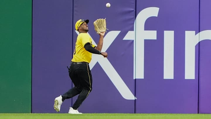 Pittsburgh, Pennsylvania, USA; Pittsburgh Pirates center fielder Michael A. Taylor (18) catches a fly ball against the Colorado Rockies during the first inning at PNC Park.