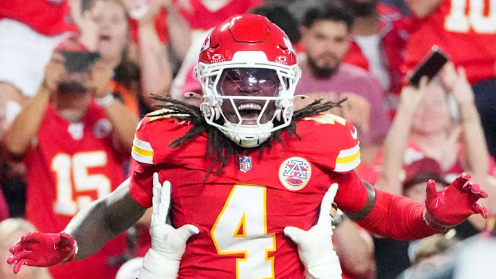 Aug 22, 2025; Kansas City, Missouri, USA; Kansas City Chiefs wide receiver Rashee Rice (4) celebrates with guard Trey Smith (65) after scoring against the Chicago Bears during the first half of the game at GEHA Field at Arrowhead Stadium. Mandatory Credit: Denny Medley-Imagn Images