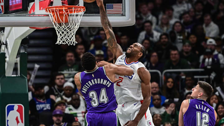 Los Angeles Clippers guard Kawhi Leonard (2) attempts a dunk against Milwaukee Bucks forward Giannis Antetokounmpo (34) in the third quarter at Fiserv Forum. Mandatory Credit: Benny Sieu-Imagn Images