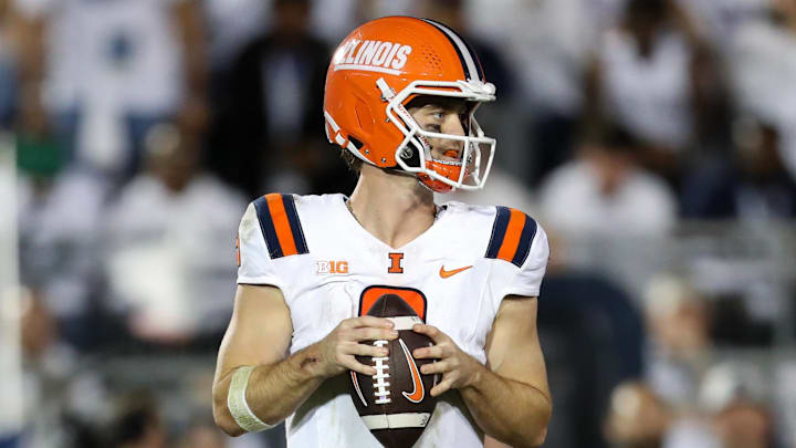 Sep 28, 2024; University Park, Pennsylvania, USA; Illinois Fighting Illini quarterback Luke Altmyer (9) drops back to throw during the third quarter against the Penn State Nittany Lions at Beaver Stadium. Penn State defeated Illinois 21-7. Mandatory Credit: Matthew O'Haren-Imagn Images