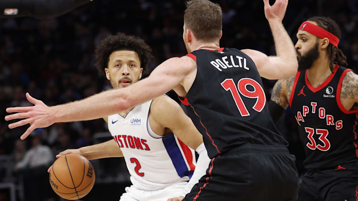 Dec 30, 2023; Detroit, Michigan, USA;  Detroit Pistons guard Cade Cunningham (2) dribbles defended