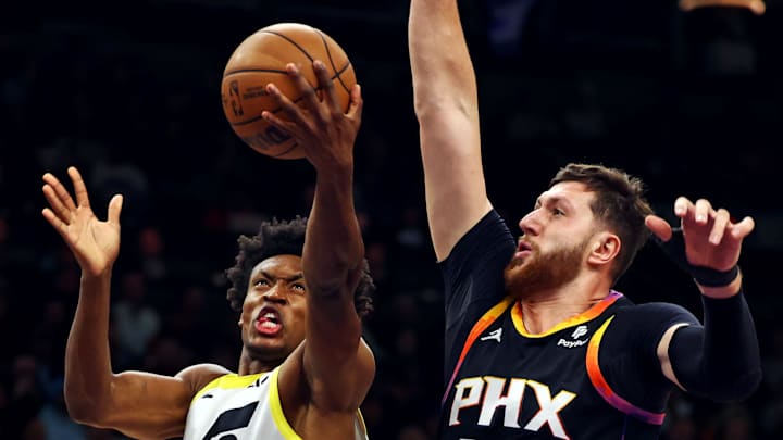 Utah Jazz guard Collin Sexton shoots the ball against Phoenix Suns center Jusuf Nurkic.