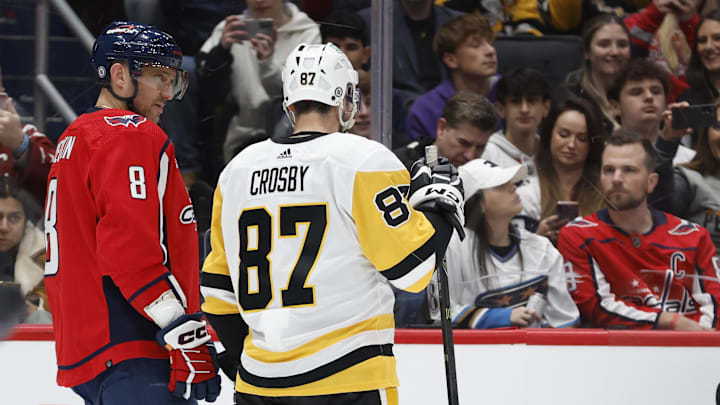 Apr 4, 2024; Washington, District of Columbia, USA; Washington Capitals left wing Alex Ovechkin (8) talks with Pittsburgh Penguins center Sidney Crosby (87) as repairs are made to the ice surface in the first period at Capital One Arena. Mandatory Credit: Geoff Burke-Imagn Images