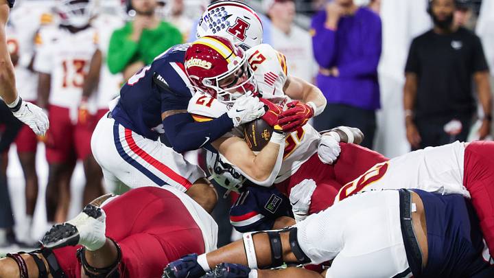 Oct 24, 2026; Tucson, Arizona, USA;  Iowa State Cyclones running back Aiden Flora (21) is tackled during the third quarter against the Arizona Wildcats at Casino Del Sol Stadium.  Mandatory Credit: Aryanna Frank-Imagn Images