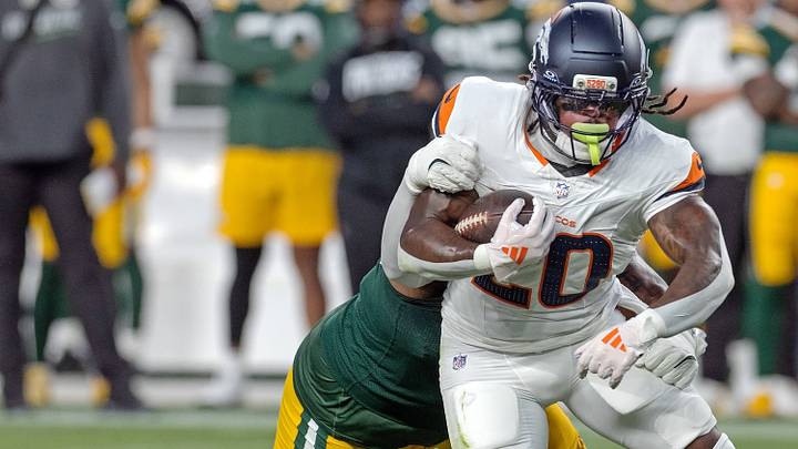 August 22, 2026, Denver, Colorado, USA: Broncos JONAH COLEMAN runs for tough yardage with a Packers defender all over him during the 2nd. Half at Empower Field at Mile High Friday evening. Packers beat the Broncos in Pre-Season 33-13. August 22, 2026, Denver, Colorado, USA: Broncos JONAH COLEMAN runs for tough yardage with a Packers defender all over him during the 2nd. Half at Empower Field at Mile High Friday evening. Packers beat the Broncos in Pre-Season 33-13.