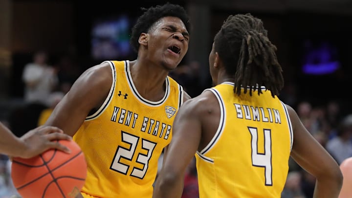 Kent State Golden Flashes forward Delrecco Gillespie (23) celebrates with guard Jamal Sumlin (4) during a Mid-American Conference Tournament semifinal March 14, 2025, in Cleveland.