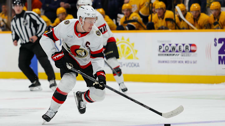 Jan 22, 2026; Nashville, Tennessee, USA;  Ottawa Senators left wing Brady Tkachuk (7) skates with the puck against the Nashville Predators during the first period at Bridgestone Arena. Mandatory Credit: Steve Roberts-Imagn Images